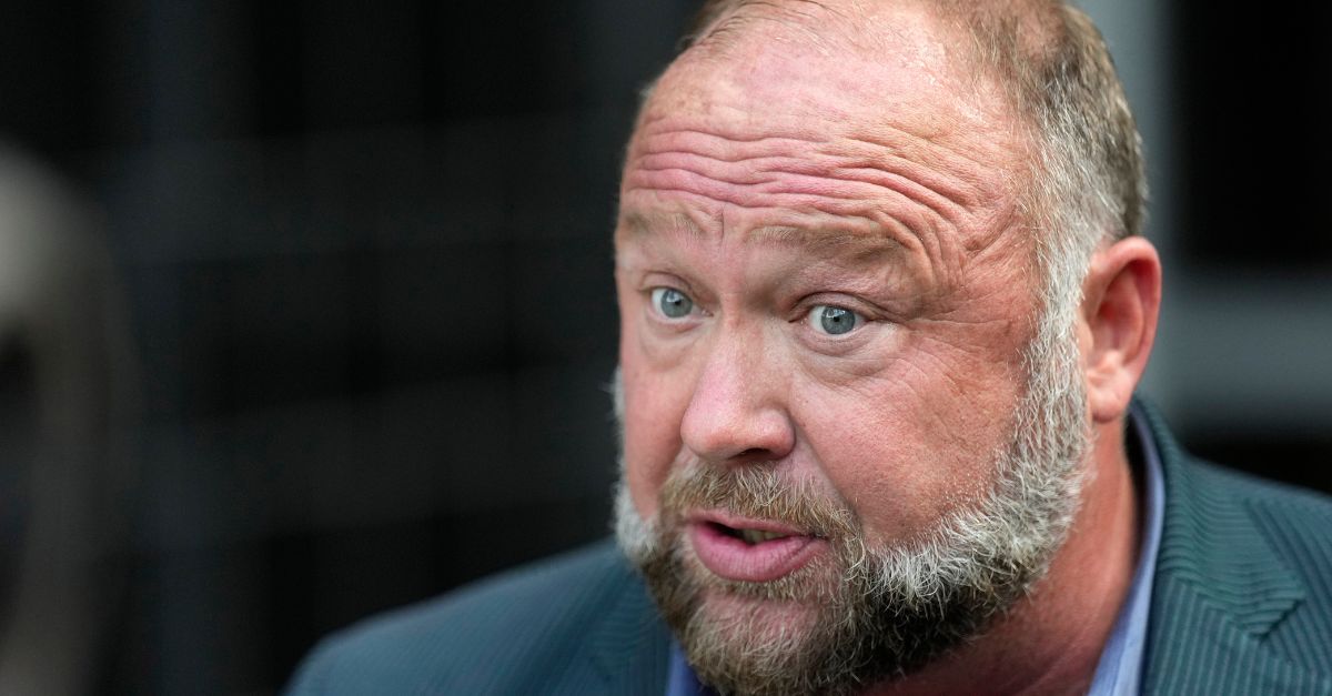 Right-wing conspiracy theorist Alex Jones speaks to the media after arriving at the federal courthouse for a hearing in front of a bankruptcy judge Friday, June 14, 2024, in Houston. (AP Photo/David J. Phillip)