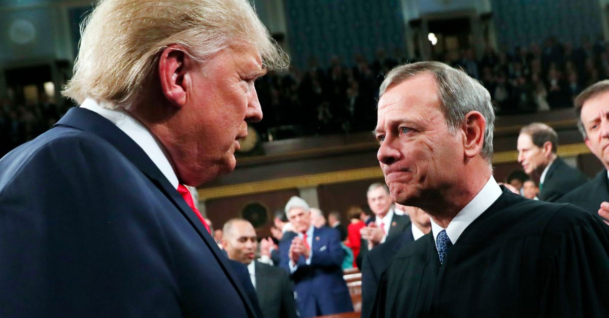 President Donald Trump greets Supreme Court Chief Justice John Roberts as he arrives to deliver his State of the Union address to a joint session of Congress in the House Chamber on Capitol Hill in Washington, Tuesday, Feb. 4, 2020 (Leah Millis/Pool via AP).