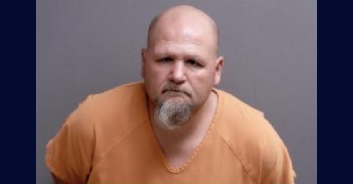 Jason Smith appears in a booking photo.