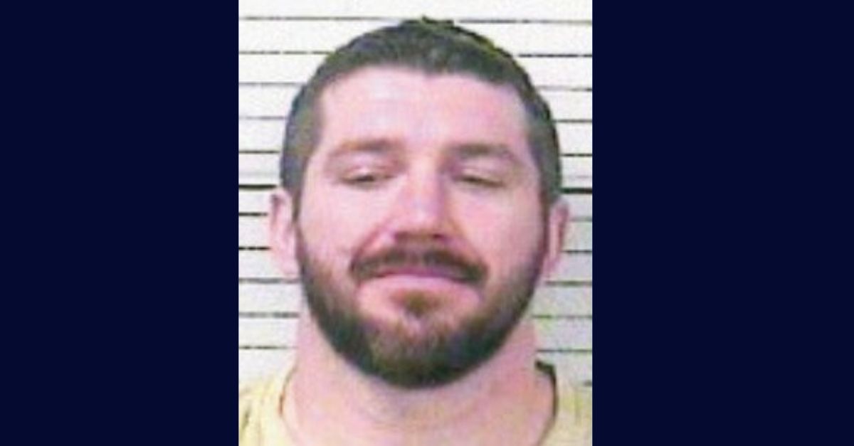 Shawn Asher appears in a booking photo.