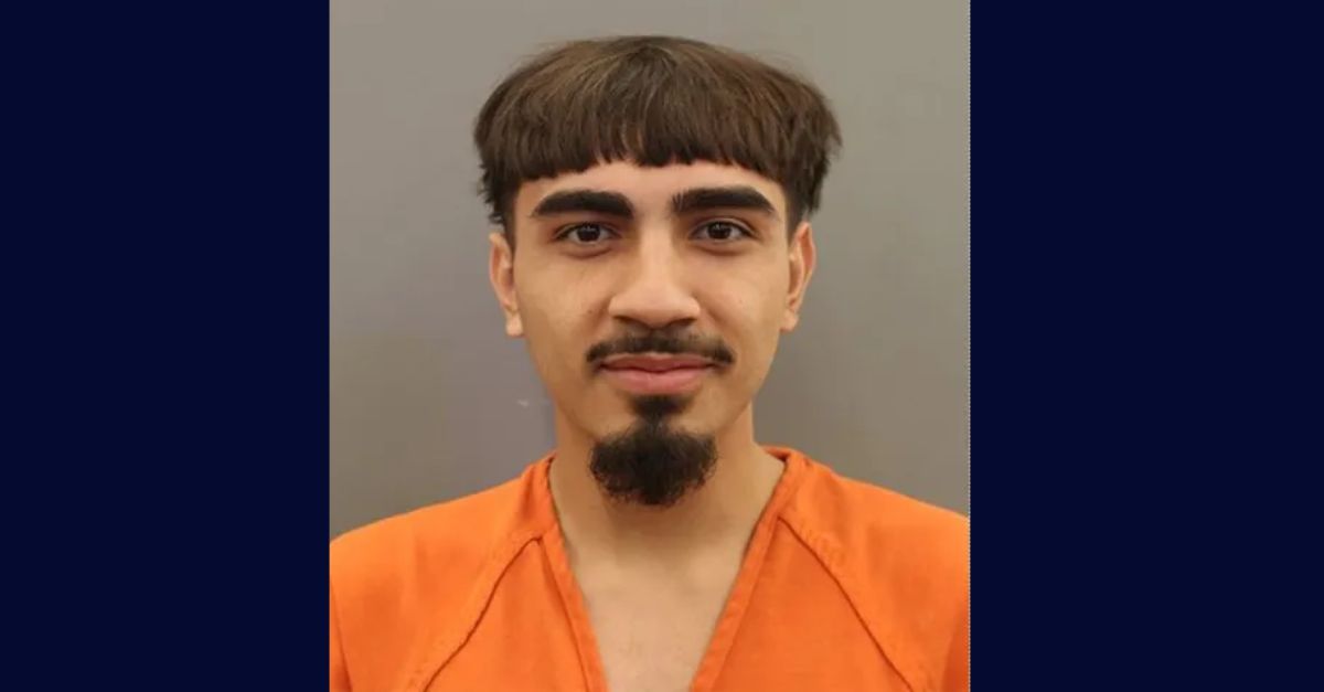 Romeo Aguilar appears successful  a booking photo.