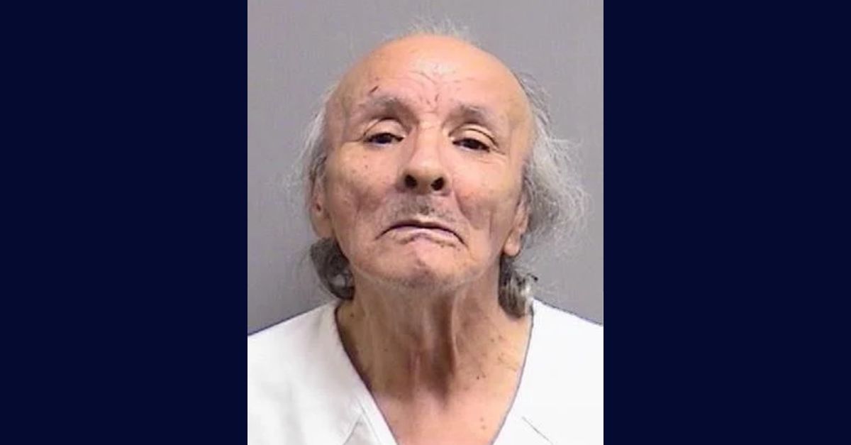 Michael Ackerman appears in a booking photo.