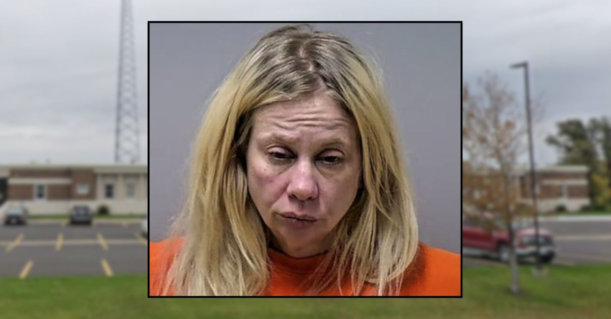 Woman arrested after fatal crash