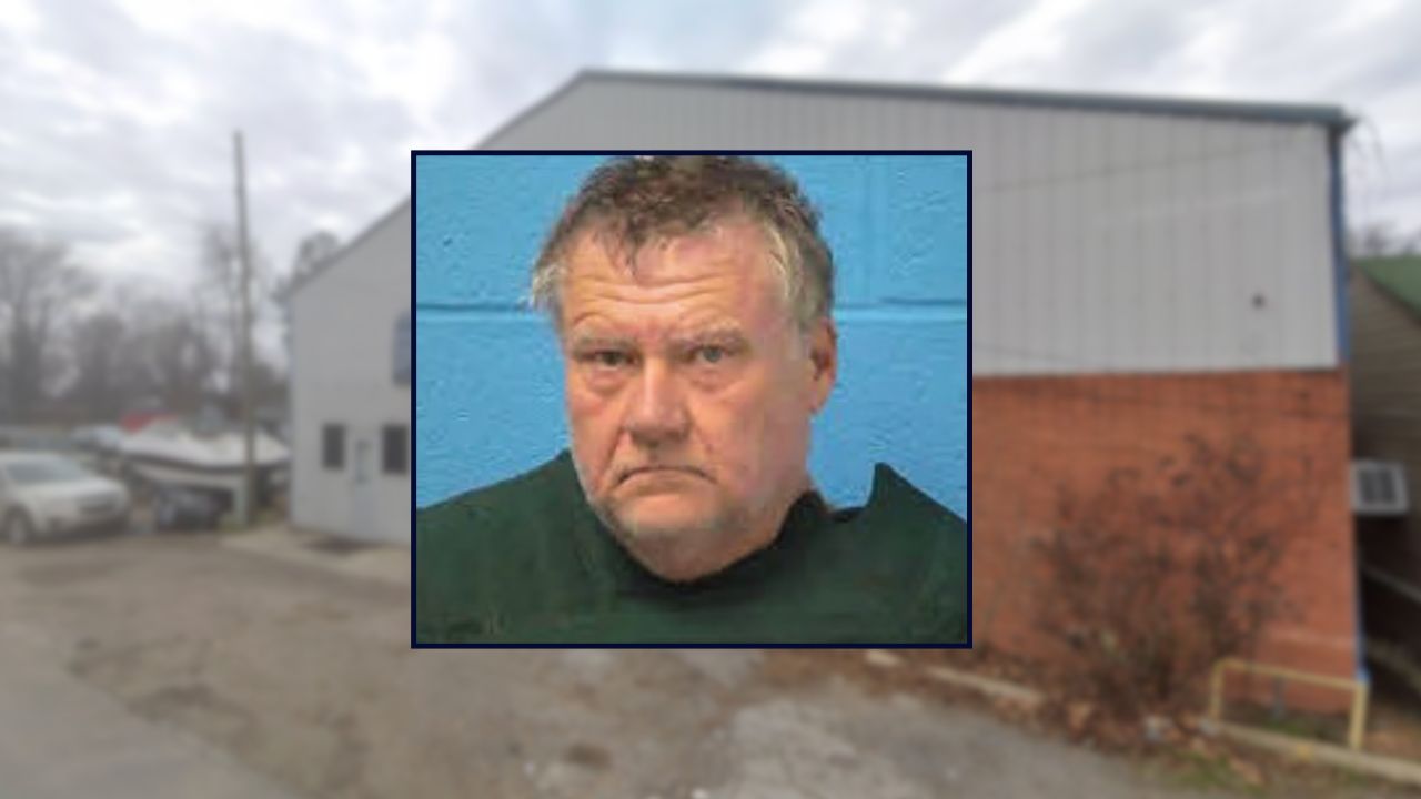 Rudy Ray appears in a booking photo inset against an image of an auto shop in Arkansas.