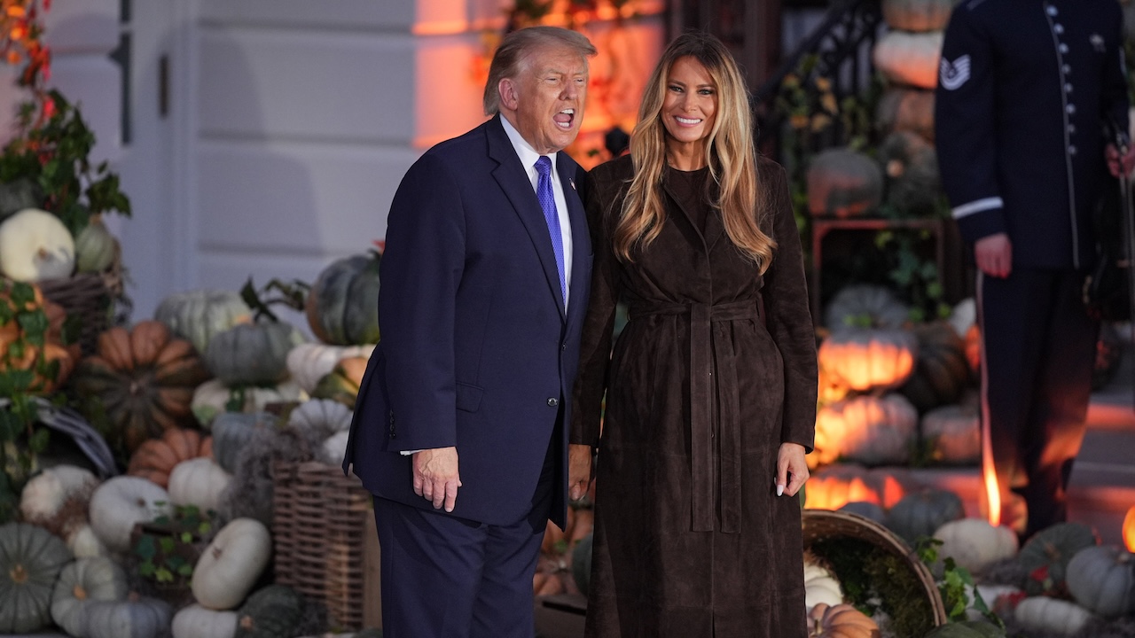 President Donald Trump and first lady Melania Trump attend a Halloween event with families on the South Lawn of the White House.